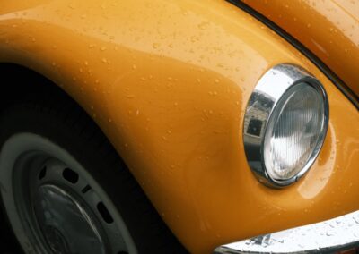 Close-up of a yellow vintage car fender