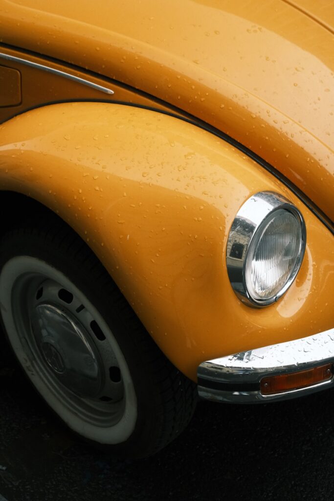 Close-up of a yellow vintage car fender